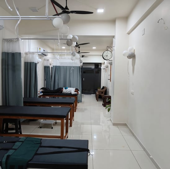 Inside the Physio Buddy physiotherapy clinic in Chandkheda, treatment beds and cubicles